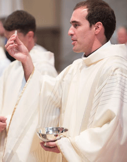 Fr. Sundrup giving communion