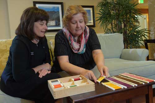 Kathleen Farfsing, left, and Maria, work on a color matching exercise.