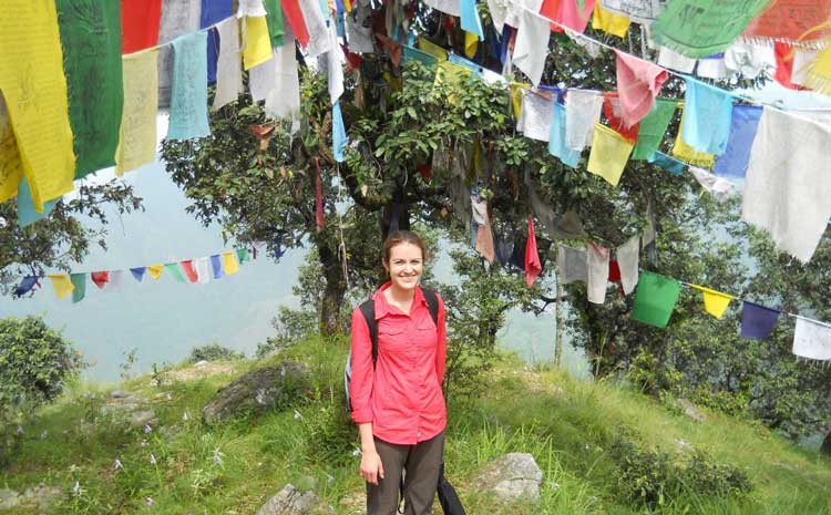 Photo of Margaret Weidner surrounded by colorful towels