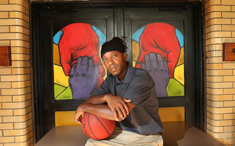 Sherwin Anderson holding a basketball. 