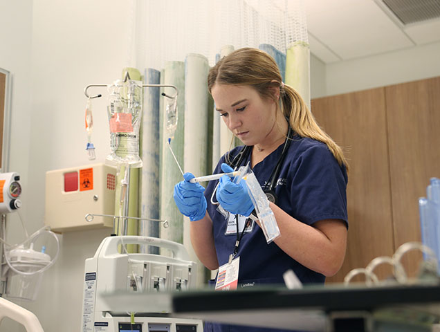 A group of Xavier nursing students learning onsite 