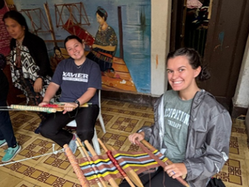 Xavier OTD students participating in backstrap weaving at TRAMA.  
