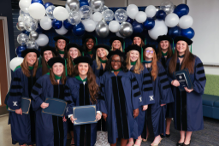 OTD class of 2026 pose for photo after ceremony