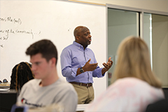 Photo of Professor teaching inside a Classroom