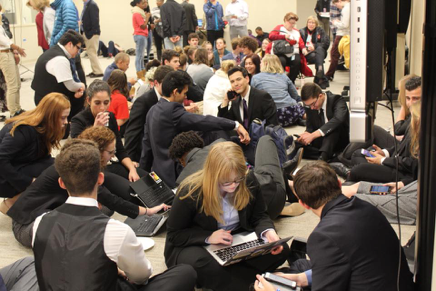 Photo of Student Interns woking together in a hall