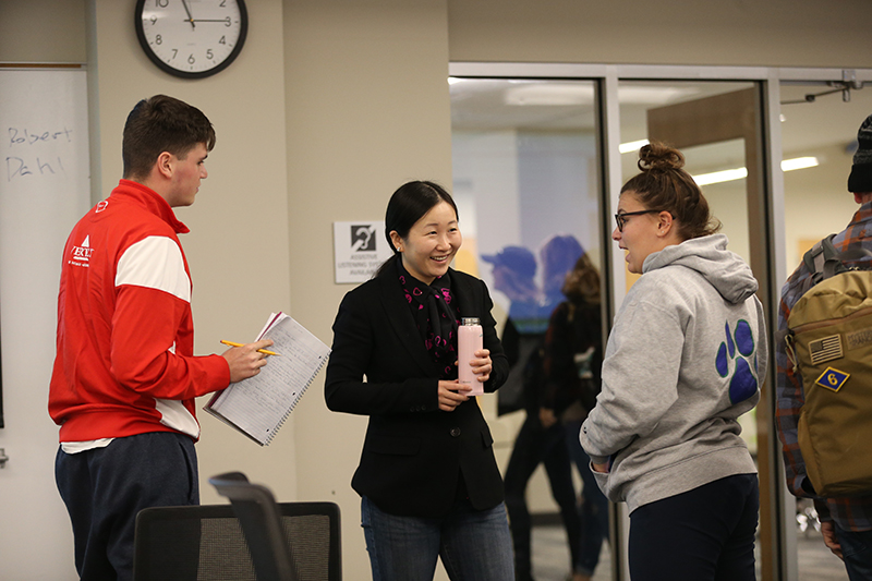 Photo of Three Political Science Students having a Discussion