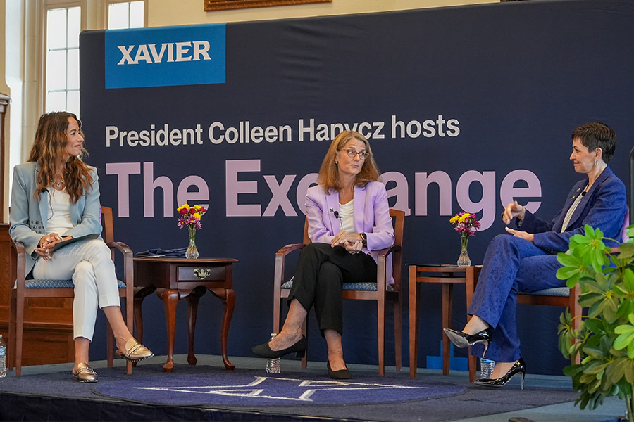 Penny Pennington, President Hanycz and another individual having a discussion