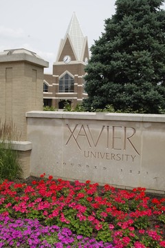 Xavier University Sign with Gallagher Student Center in the background picture