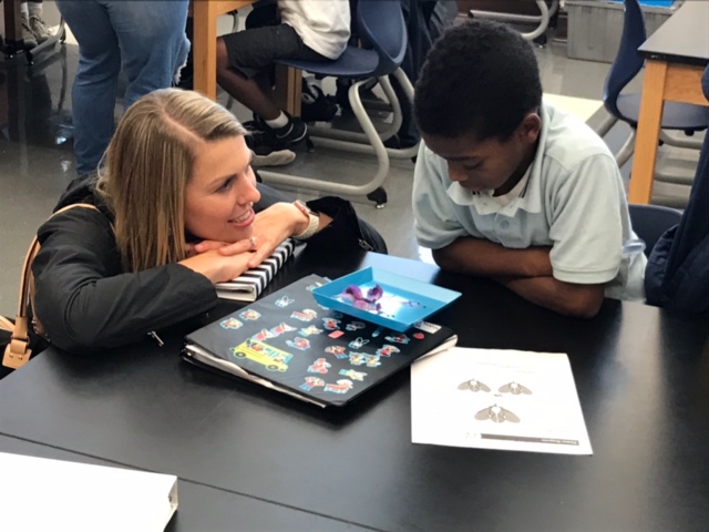 Photo of a Student Teacher talking with one of their Students