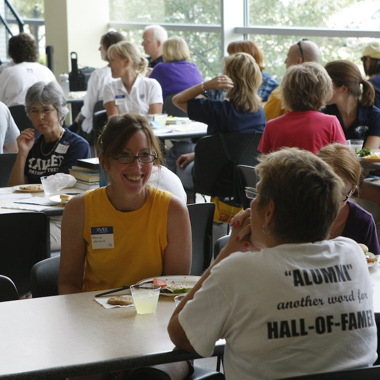 Students sitting at a table in Williams College of Business