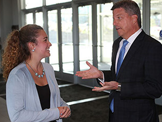 student in the social work talking with a mentor