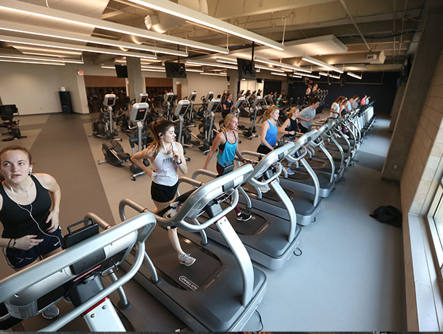 Xavier students running on treadmills inside the Health United Building