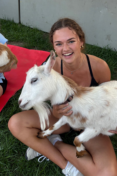 Nora holding a goat