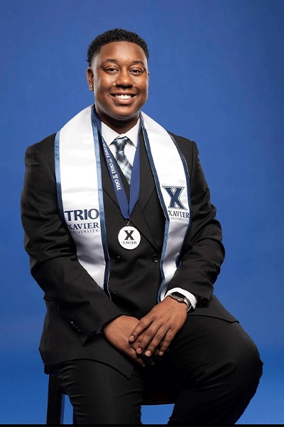 Trio graduate with Trio sash