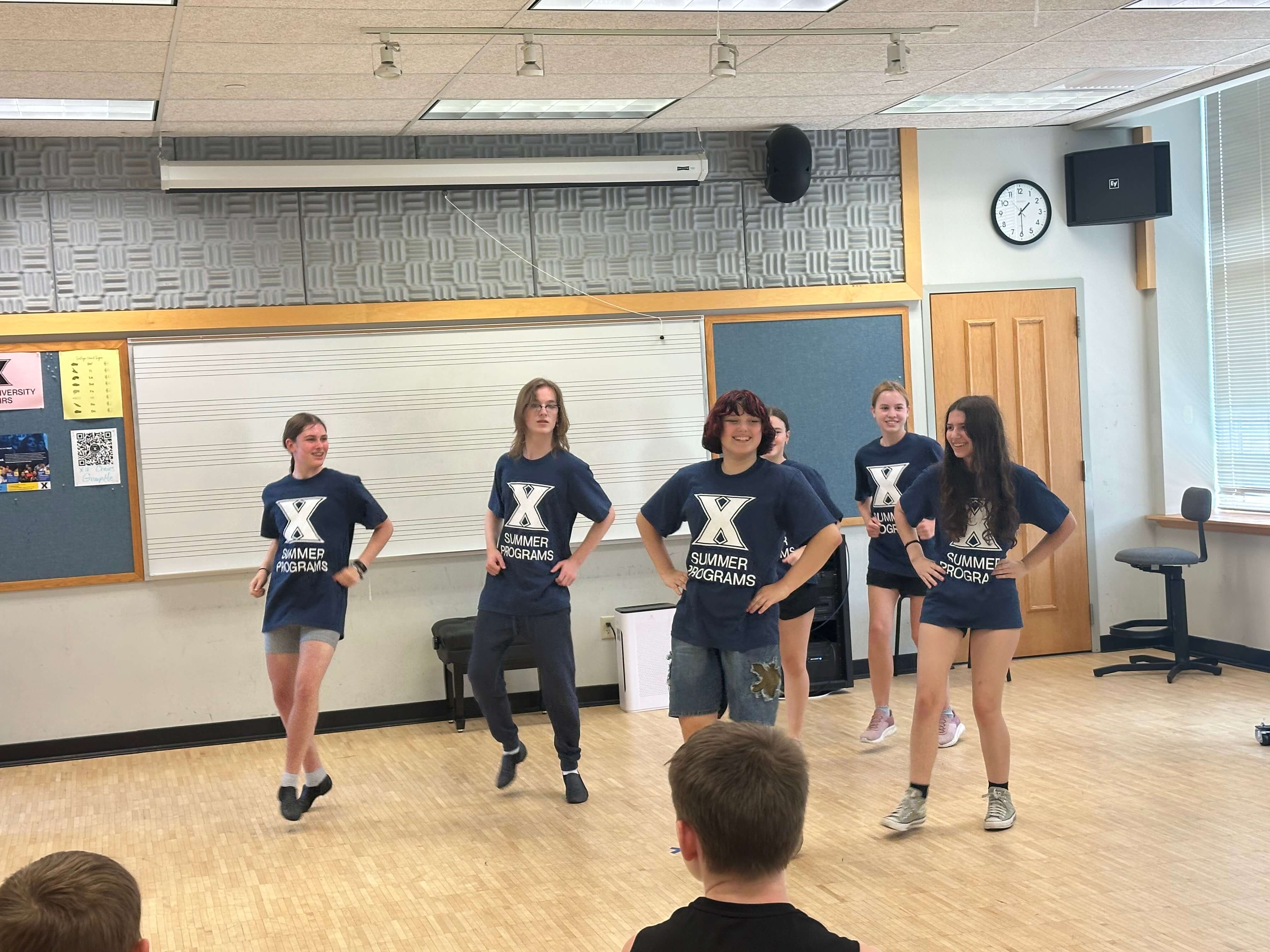 4 summer programs students performing an act