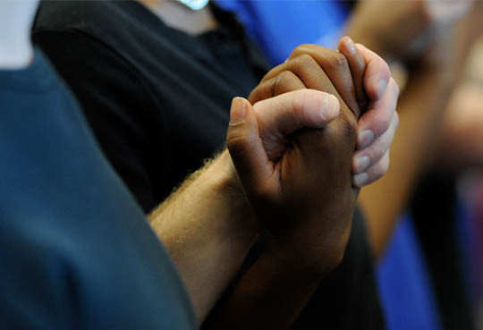 A close up of two hands clasped together
