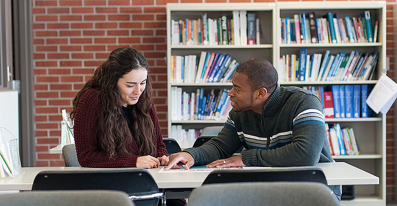 Theology student talking with her counselor