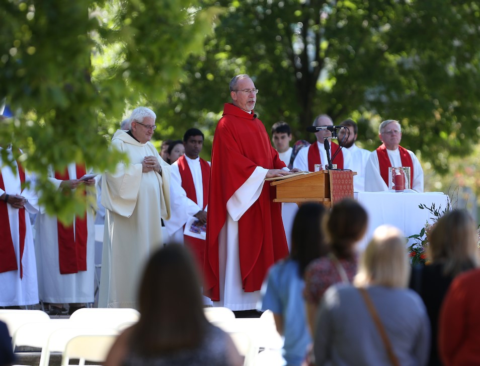 Father Graham presiding over an outdoor mass