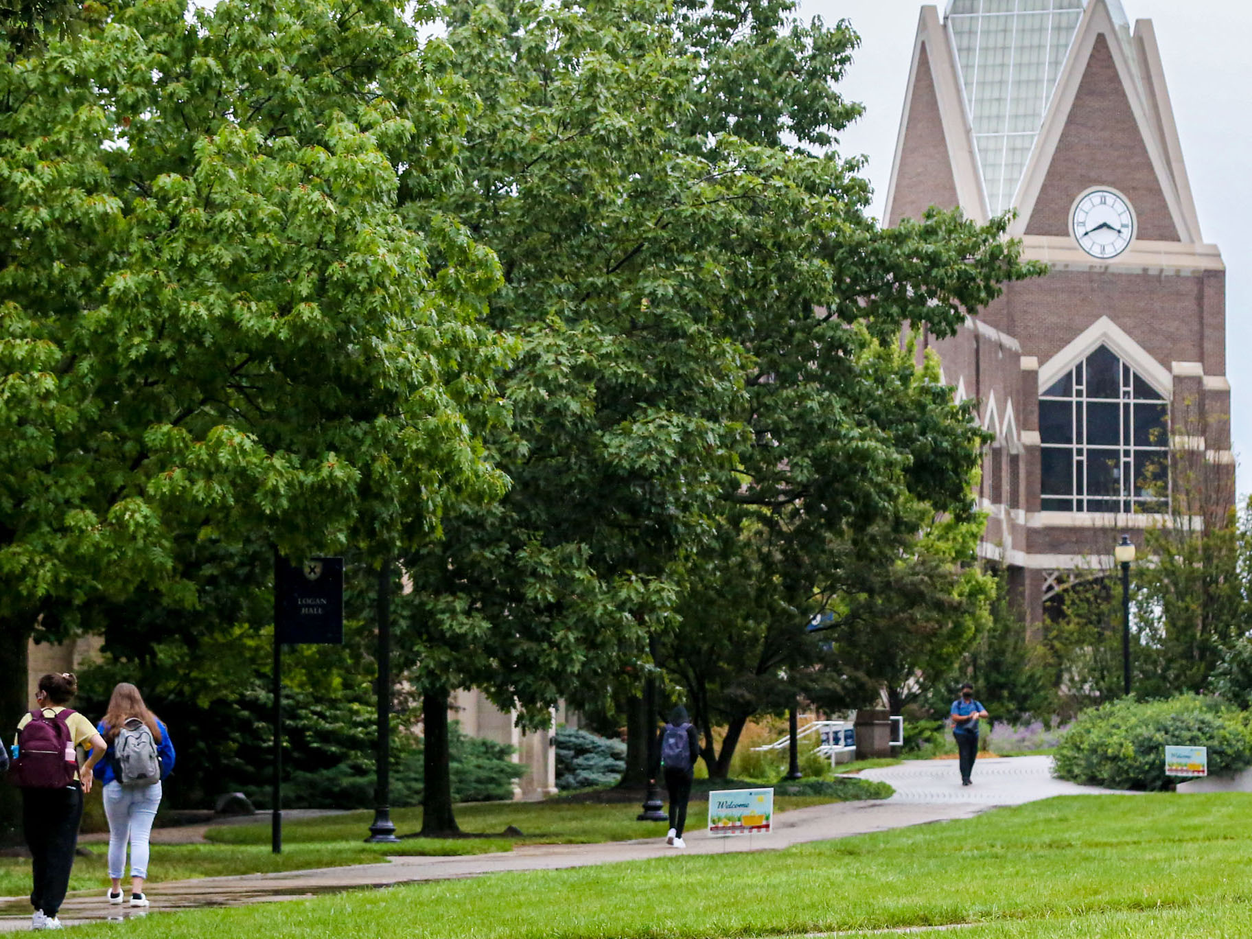 A group of Xavier students walking towards Gallagher Student Center.