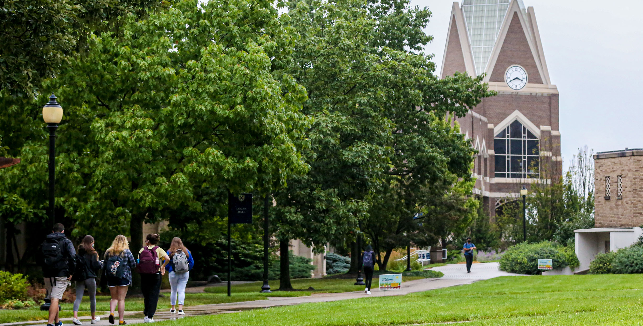 A group of Xavier students walking towards Gallagher Student Center.