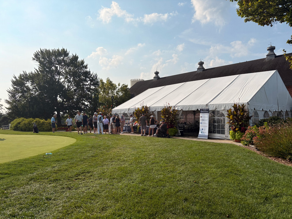 Golf Event participants outside gazebo